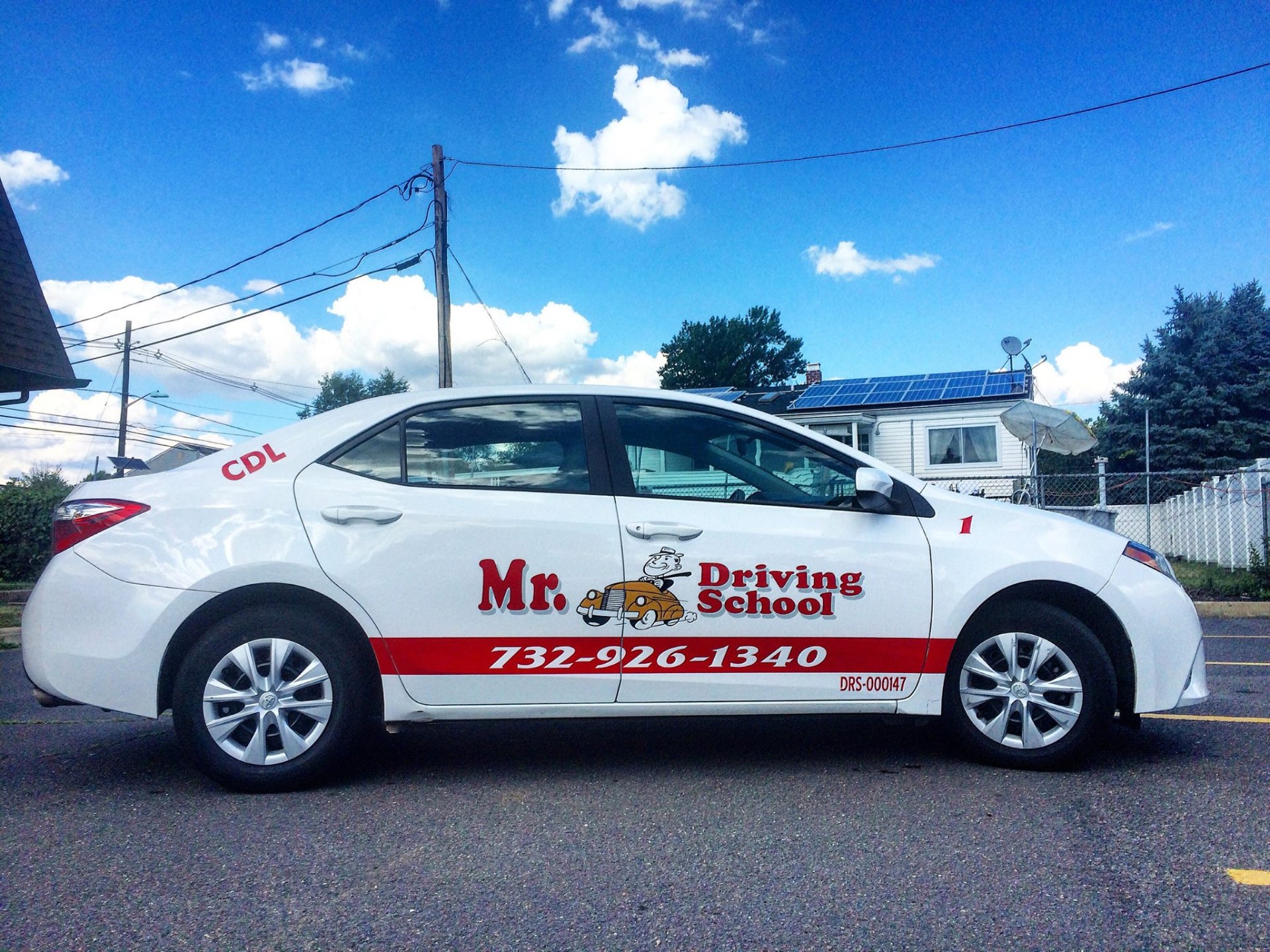 Mr. Driving School branded vehicle
