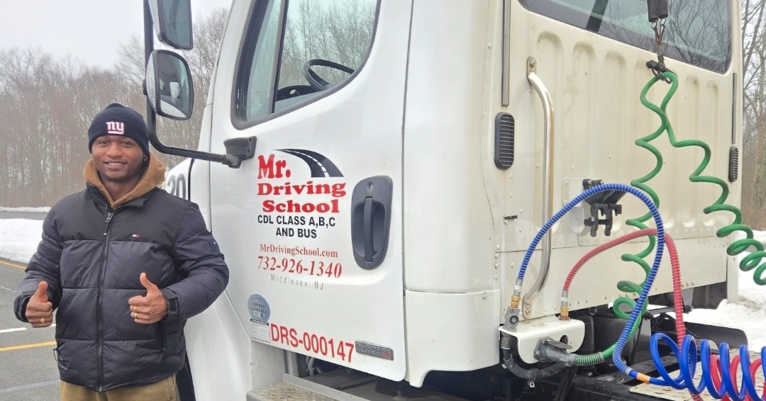 Successful CDL graduate thumbs up